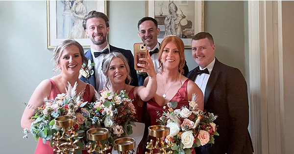 Bridal party taking a mirror selfie